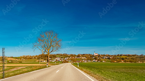 Spring landscape with a church on a sunny day near Thuernthenning, Moosthenning, Dingolfing, Landau, Bavaria, Germany