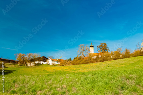 Spring landscape with a church on a sunny day near Thuernthenning, Moosthenning, Dingolfing, Landau, Bavaria, Germany