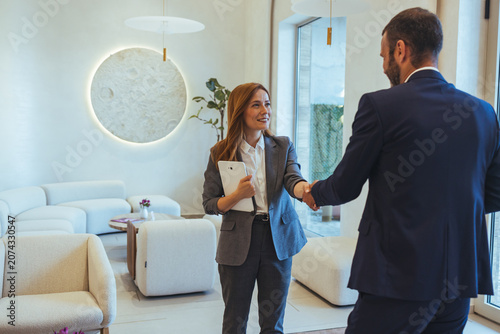 Canvastavla Professional Real Estate Agent Greeting Client With Handshake In Modern Office R