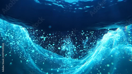 Abstract underwater light waves, particles and bubbles flowing on a deep dark blue background