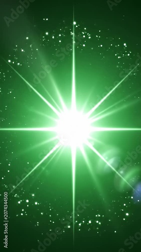 Bright white light burst with lens flare on green.