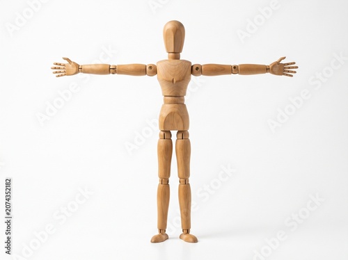 Wooden Artist Mannequin Standing with Arms Outstretched on a Plain White Background for Anatomy Study