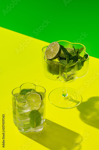 Refreshing mojito cocktail with fresh lime and mint on vibrant background