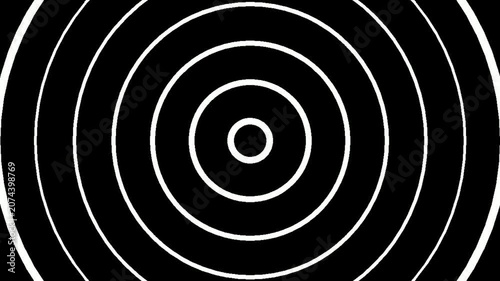 Concentric circles radiating outwards on a black background, creating a hypnotic visual effect.