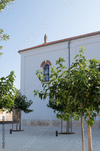 Church of St. Anastasia surrounded by trees in Biograd na Moru, Dalmatia, Croatia