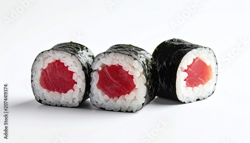 Three tuna sushi rolls with seaweed, rice, and bright red fish