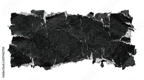 A rectangular piece of black crumpled paper with rough torn white edges
