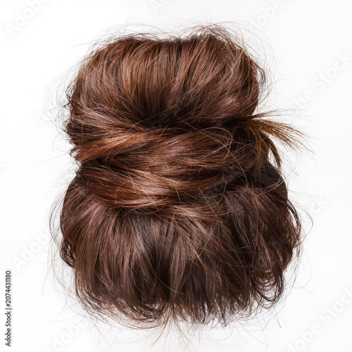 Elegant messy bun hairstyle with flowing tendrils of hair