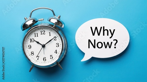 Alarm Clock with Why Now Speech Bubble on Blue Background.