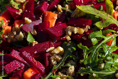  Closeup of fresh beetroot salad with walnuts and arugula