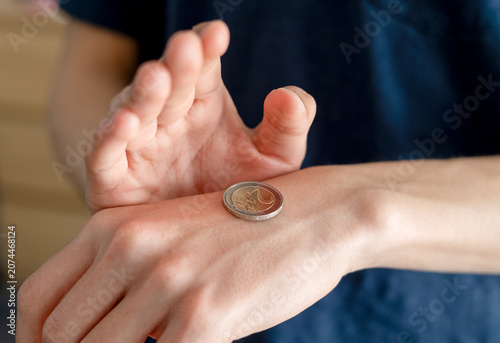 Close‑Up Hand Tossing a Coin Representing risk assessment symbolizing probability, decision‑making, risk, and fifty‑fifty choices, winning chances concept