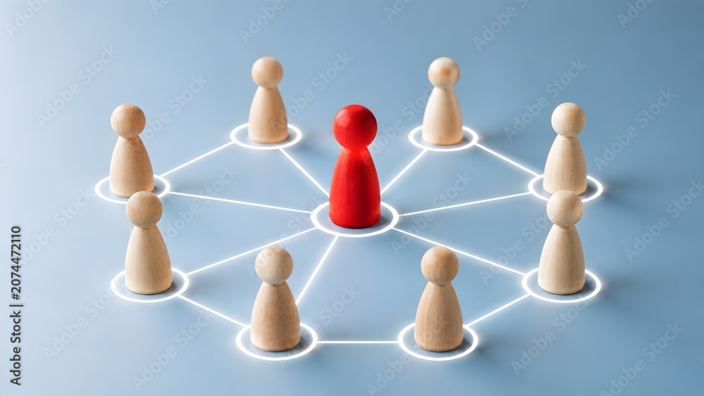 Obraz premium Leadership and team management network concept with a central red wooden figure connected to a team by glowing white lines