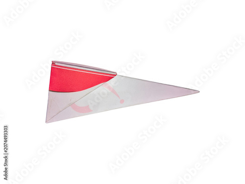Red paper triangle folded origami shape on flat surface isolated on transparent background