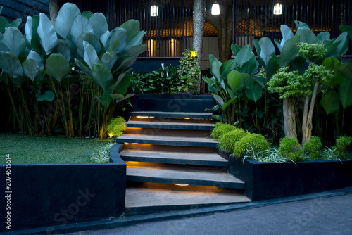 Tableau sur toile Modern concrete garden steps with integrated warm LED lighting at night leading
