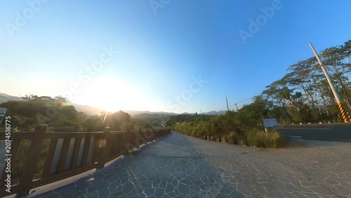 Stone pathway with wooden railing at sunset outdoor recreation