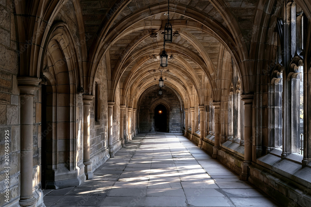 Obraz premium Gothic Stone Cathedral Corridor with Pointed Arches and Hanging Lanterns