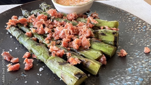 Gourmet green asparagus salad with foie gras close up