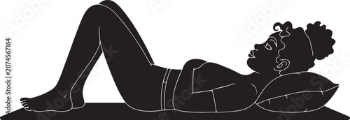 Woman relaxing in a stretched pose on pillows