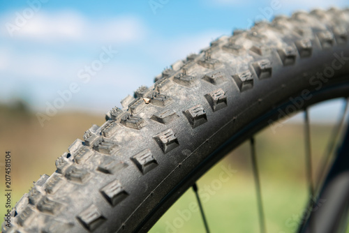 bicycle wheel close up with blurry bokeh nature background