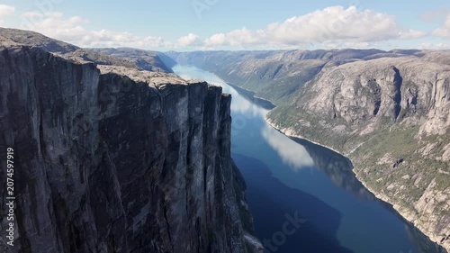 Wide Aerial Drone View of Towering Kjerag Cliff and Lysefjord Fjord Panoramic Landscape Norway