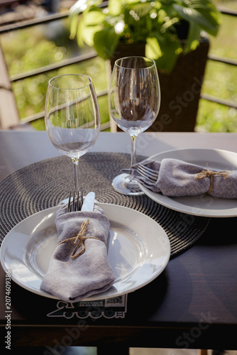 Empty wine glasses on a served table in a restaurant