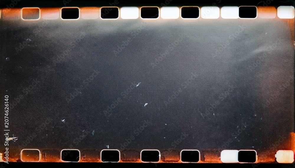 Fototapeta premium film noise texture and background old film frame from analog retro film roll photo texture with grain and scratches for vintage effect with damaged film burn look