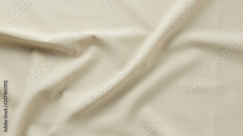 Tableau sur toile Wrinkled beige fabric texture, crumpled cream cloth background, soft rumpled lin