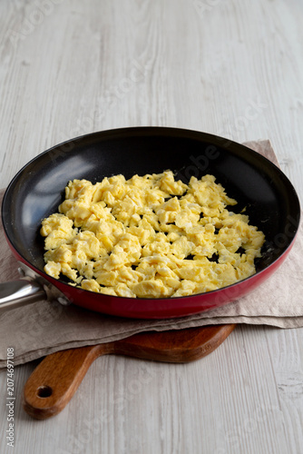 Homemade Scrambled Eggs in a Pan, side view.