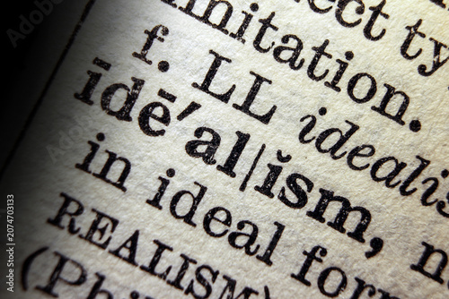 Photos Word idealism on dictionary page, macro close up