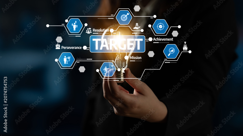 Fototapeta premium A business professional explores the concept of innovation with a light bulb, showcasing elements like target achievement and mission focus in a modern office environment. Tessel