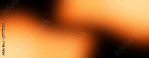 Elegant abstract orange and black gradient background featuring smooth glowing light and subtle blur