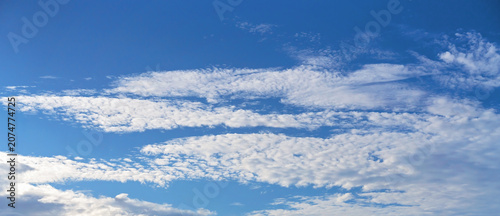 Fotografie Blue sky and cloud backgrounds with dramatic cumulus and cirrus formations, perfect for replacing skies, replacing photo backgrounds, compositing, photo editing, design and creative projects