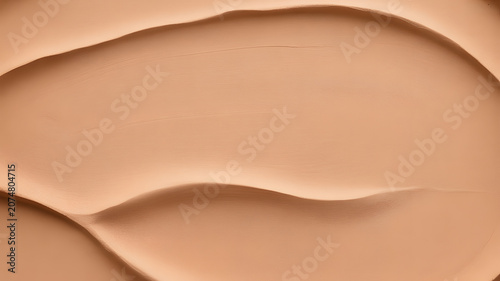 Smooth beige foundation makeup swatches on a neutral background for cosmetic product advertising and beauty marketing campaigns with natural lighting and soft shadows.