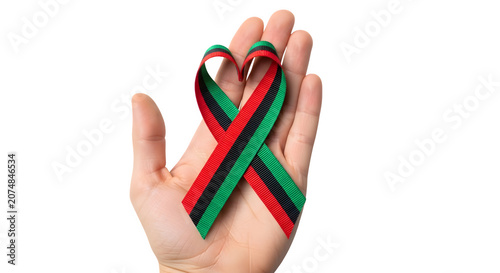 Hand holding a heart shaped Juneteenth ribbon on a transparent background