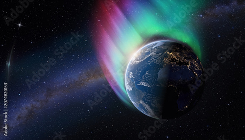 The aurora borealis illuminates Earth from space with vibrant colors.