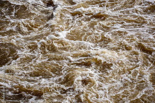 фотографія Close up of turbulent river water surface.