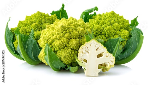 A vibrant close-up of three Romanesco broccoli heads with intricate, fractal patterns and lush green leaves, alongside a cross-section showing the internal structure