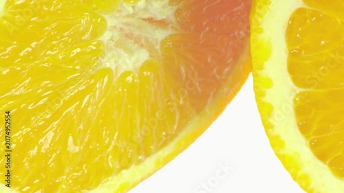 Slow Panning Shot Across Freshly Cut Orange Slices, Highlighting Vibrant Orange Flesh and Juicy Citrus Texture
