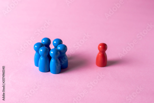 Photos Group excluding one individual symbolizing discrimination, rejection and social