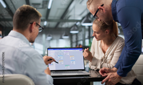 Bild auf Leinwand Marketing Manager Guides Diverse Team Through Automated Email Campaign