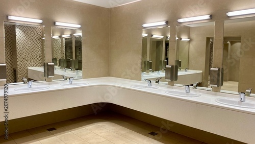 Konstfotografi Clean spacious restroom vanity area inside modern commercial building