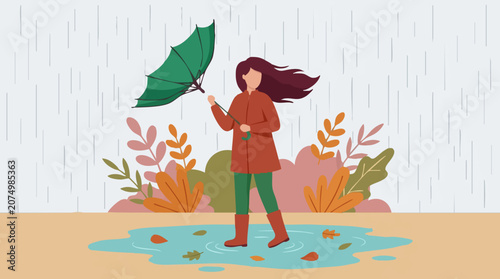 Tableau sur toile Woman in boots and raincoat holding an umbrella in autumn rain
