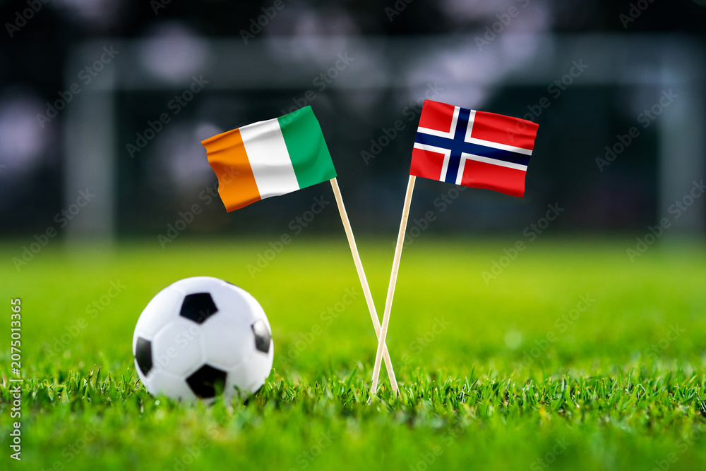 Obraz premium Ivory Coast vs Norway, national flags before international football tournament Round of 32 match, football on green grass with goal in the background, Arlington, Texas, USA, June 30, 2026