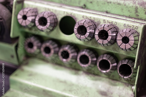 Fotografie Detail of metal clamping reducers on a drill sharpener.