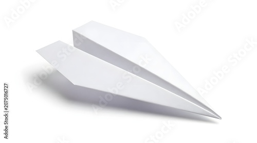 White paper airplane on plain white surface with shadow underneath simple still life