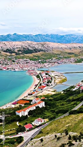 Aerial of beautiful city of Pag surrounded with sea jaw shot