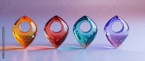 Four colorful glass pendants with unique shapes and hole in the middle, studio lighting.