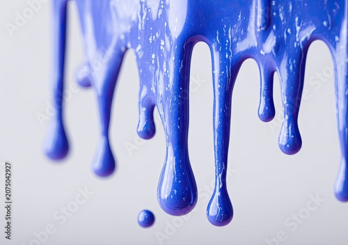 Vibrant Blue Liquid Dripping and Flowing in Abstract Macro Shot.