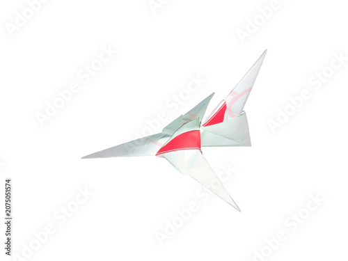Origami paper airplane flying in the air