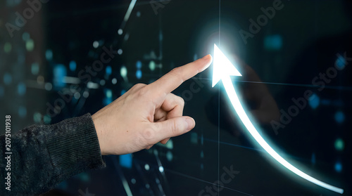 Hand pointing to glowing arrow, futuristic interface